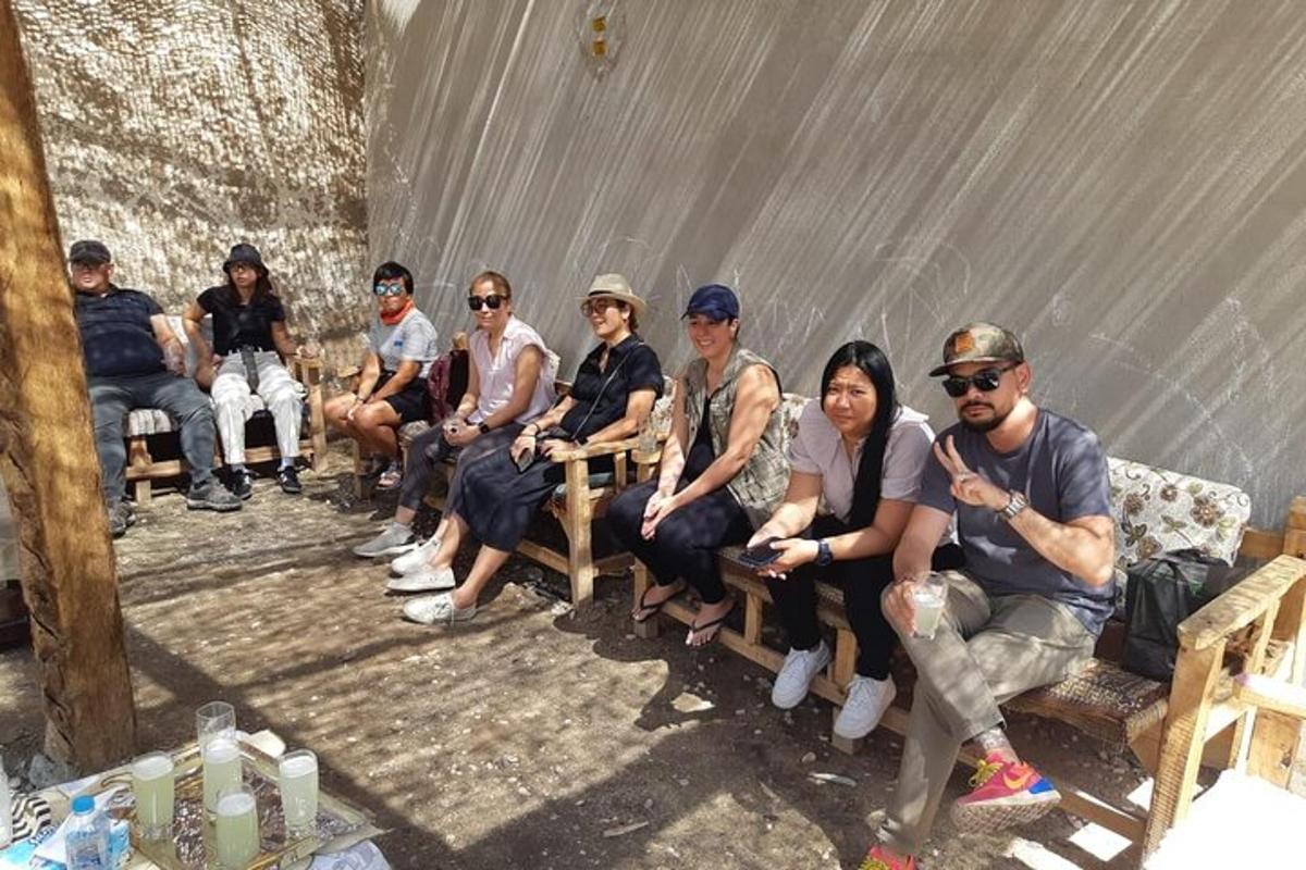 a group of people sitting on wooden benches