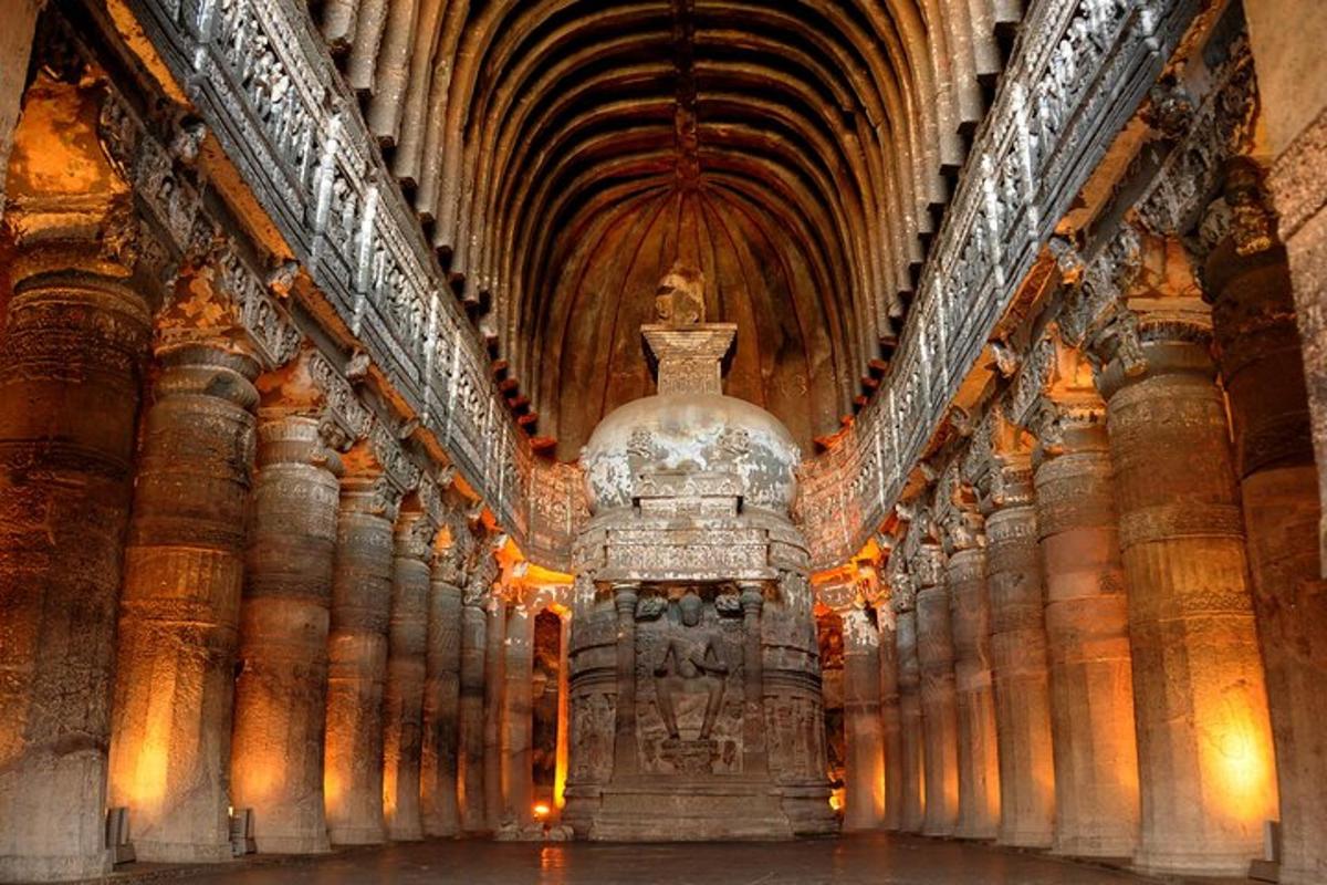 a large building with a statue in the middle