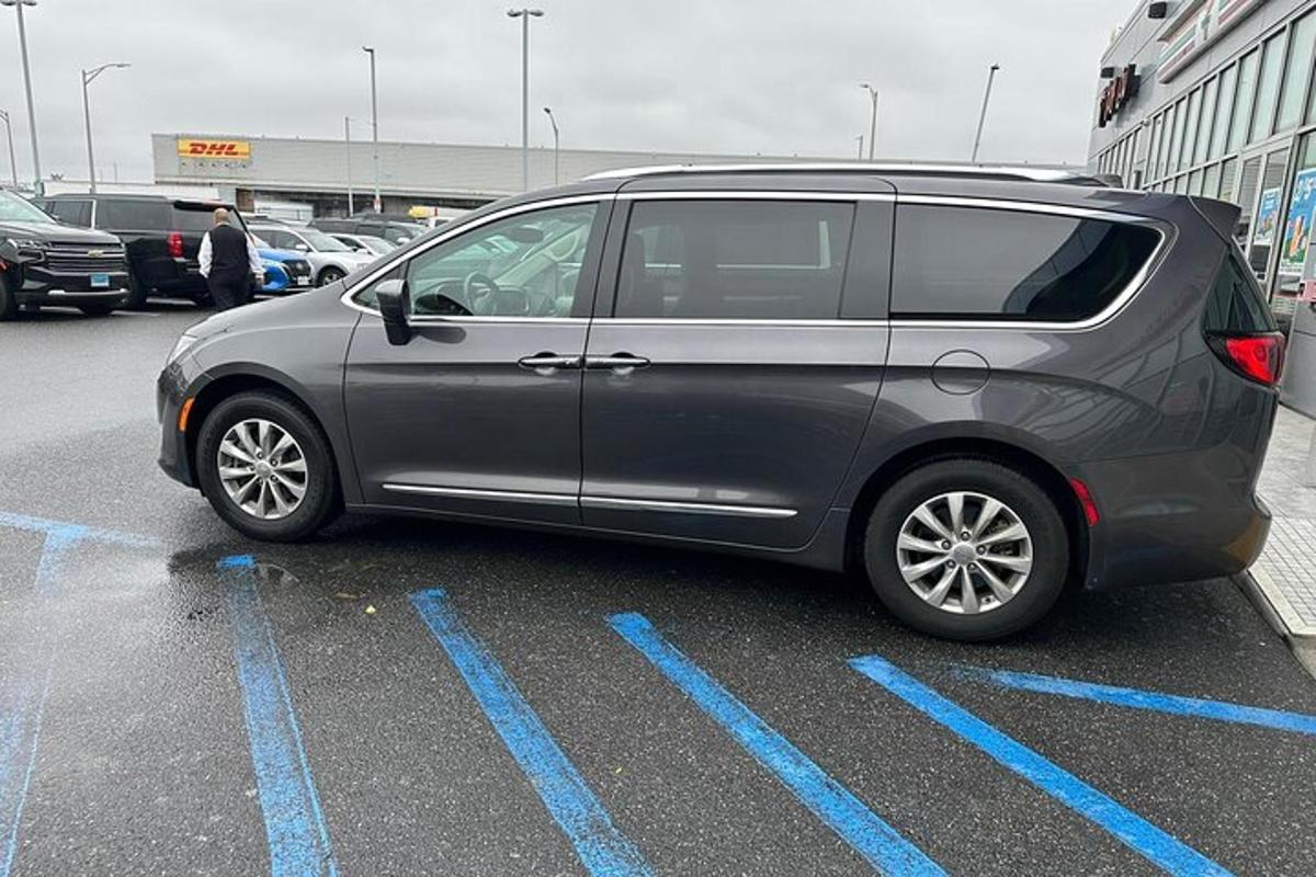 a silver van parked in a parking lot