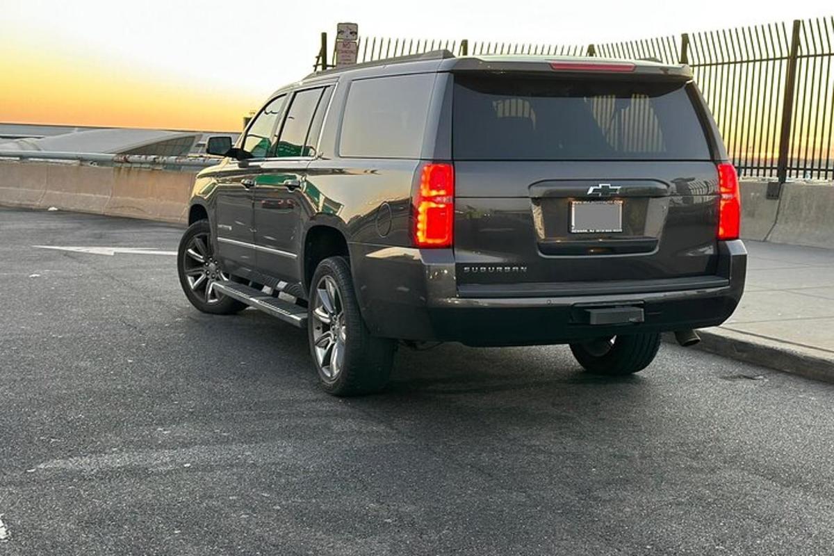 a black suv parked in a parking lot