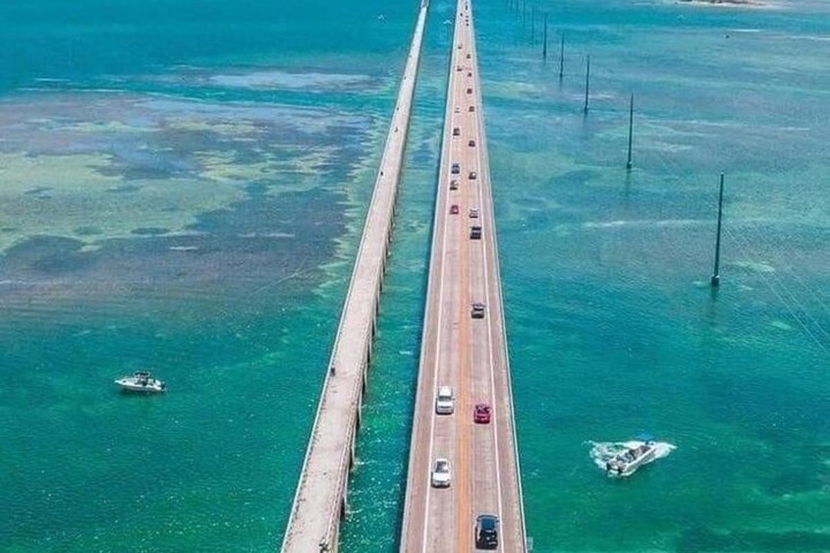 an aerial view of a bridge over the water