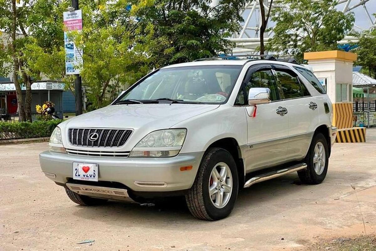 a white car parked in a parking lot