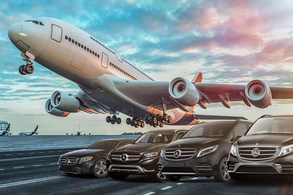 un aereo che decolla da una pista con auto parcheggiate