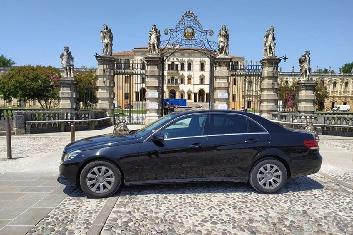 a black car parked in front of a building