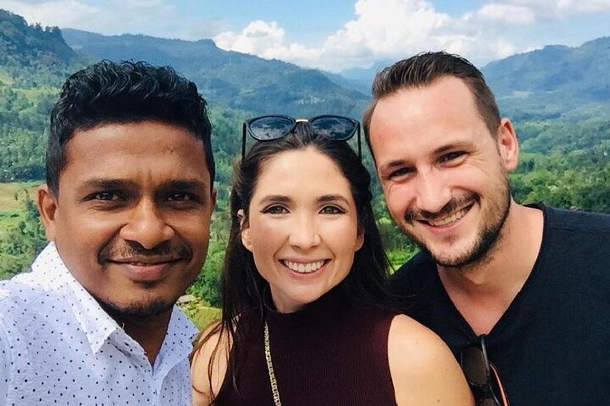a group of three people posing for a picture