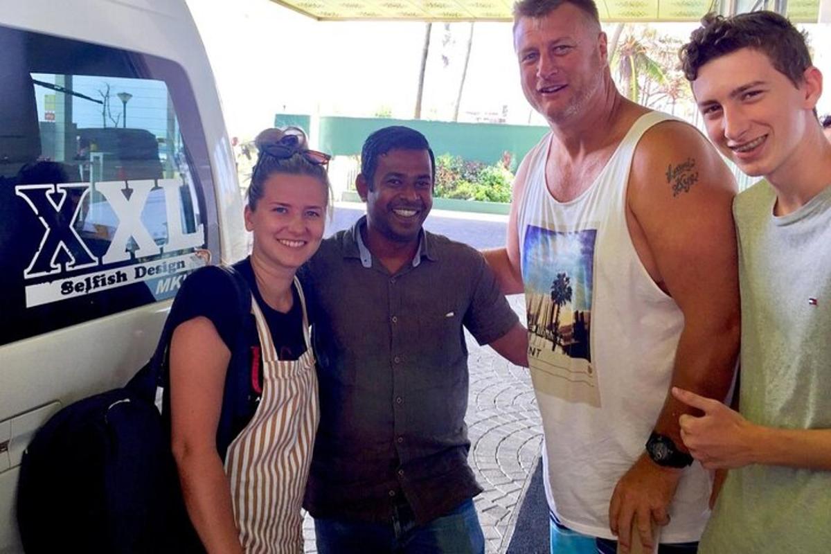 a group of people standing next to a van