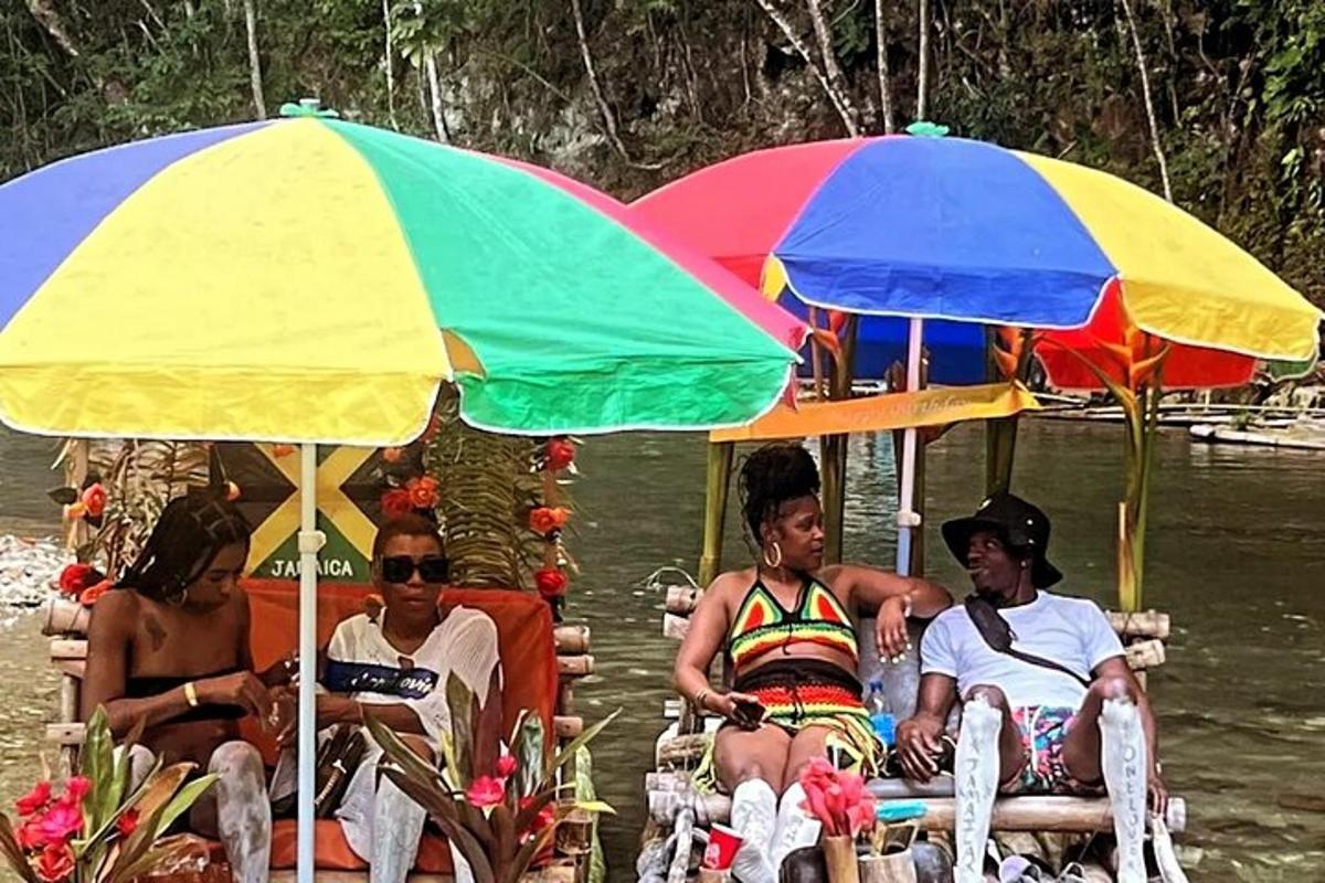 a group of people sitting under umbrellas on a boat