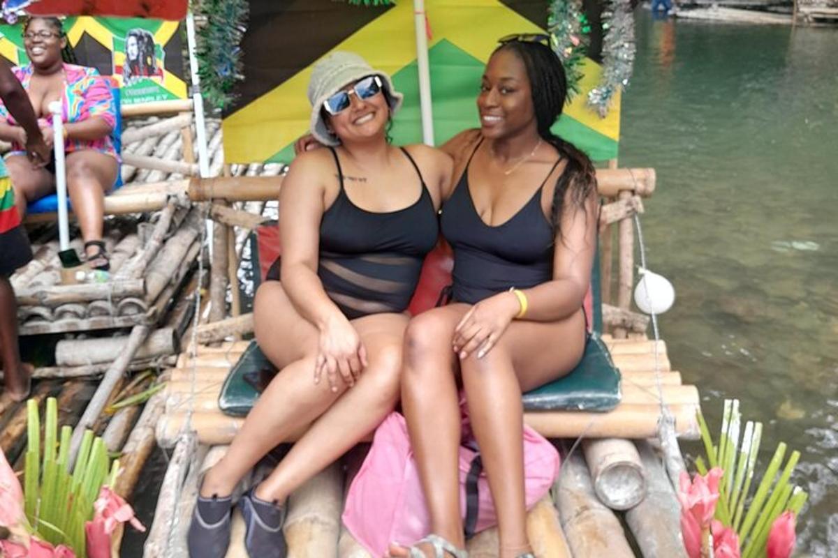 two women in bathing suits sitting on a raft