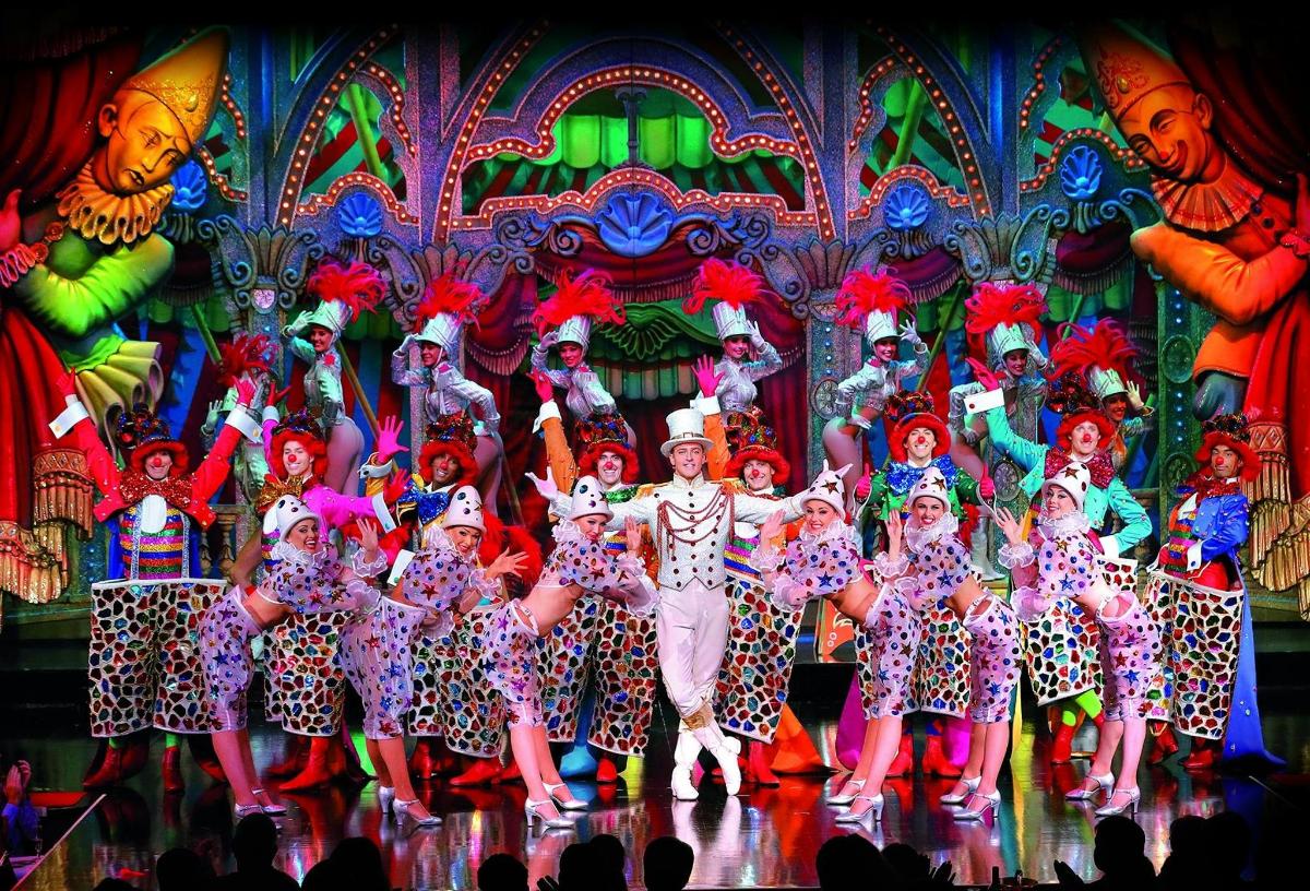 a group of performers on stage in a show