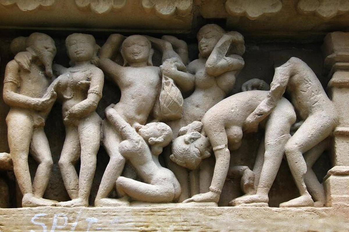 a stone relief of people on a wall