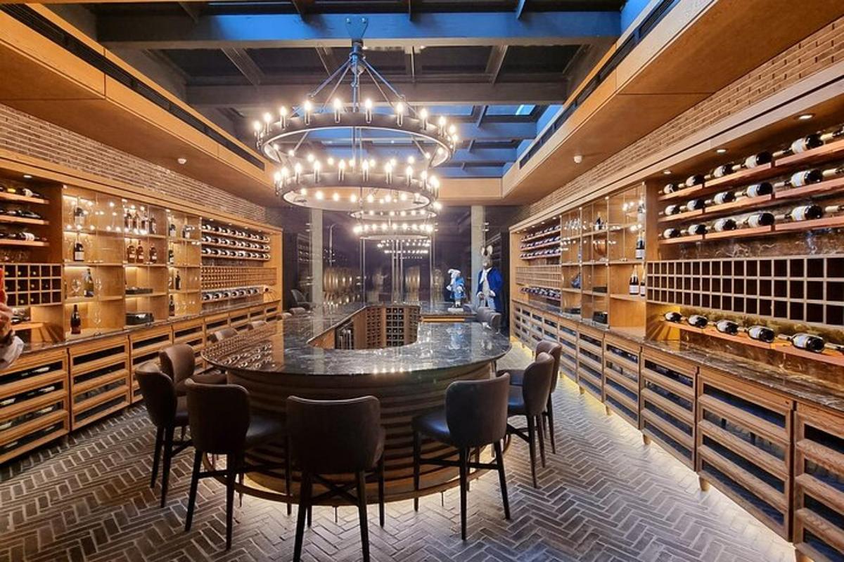 a wine tasting room with a large table and chairs