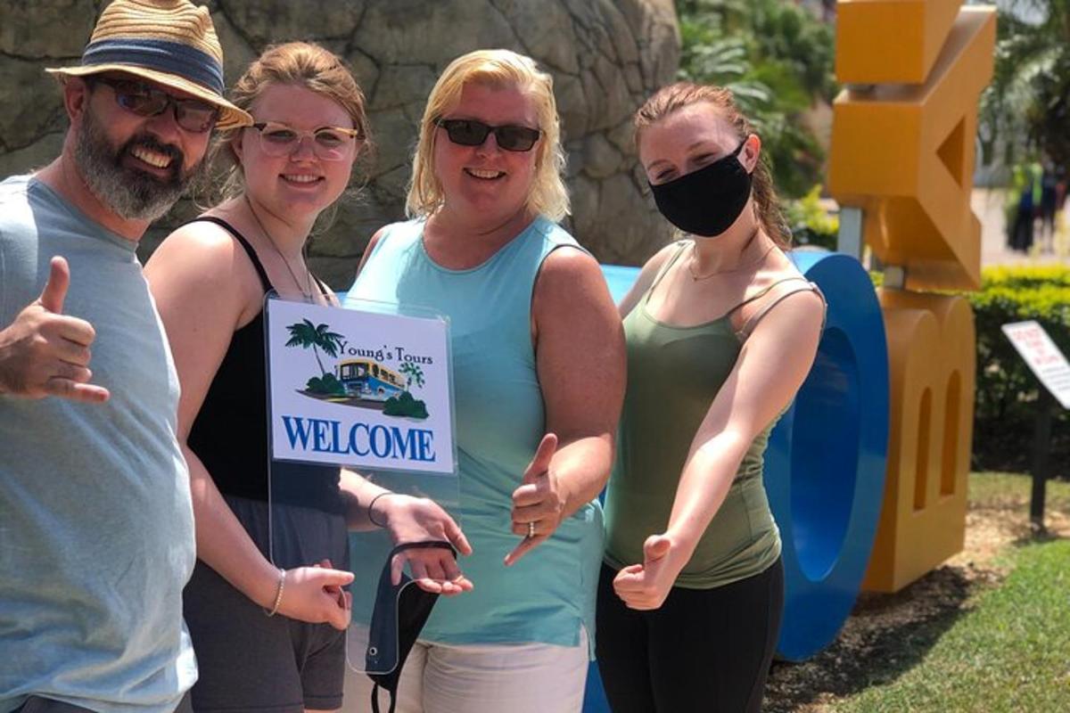 a group of people standing in front of a water slide