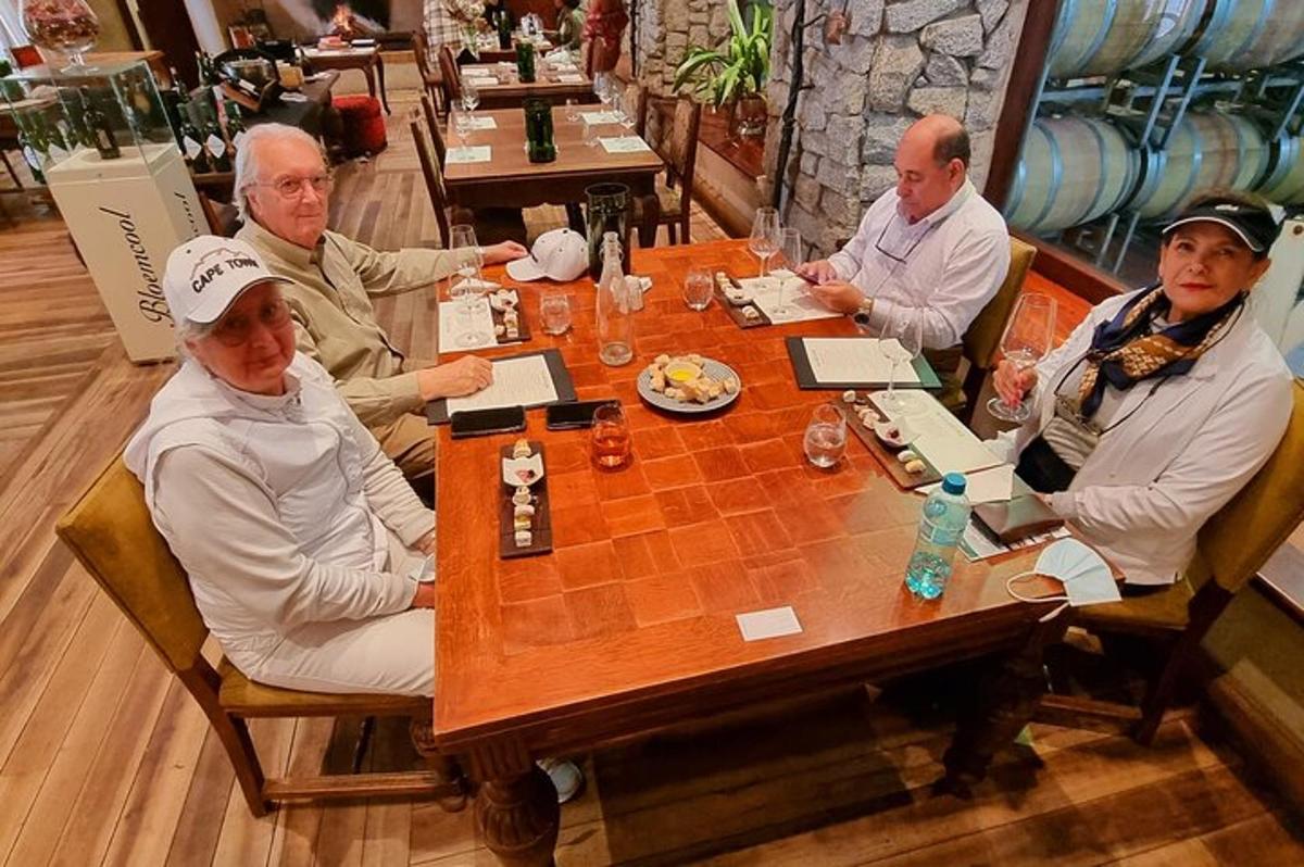 a group of people sitting around a wooden table