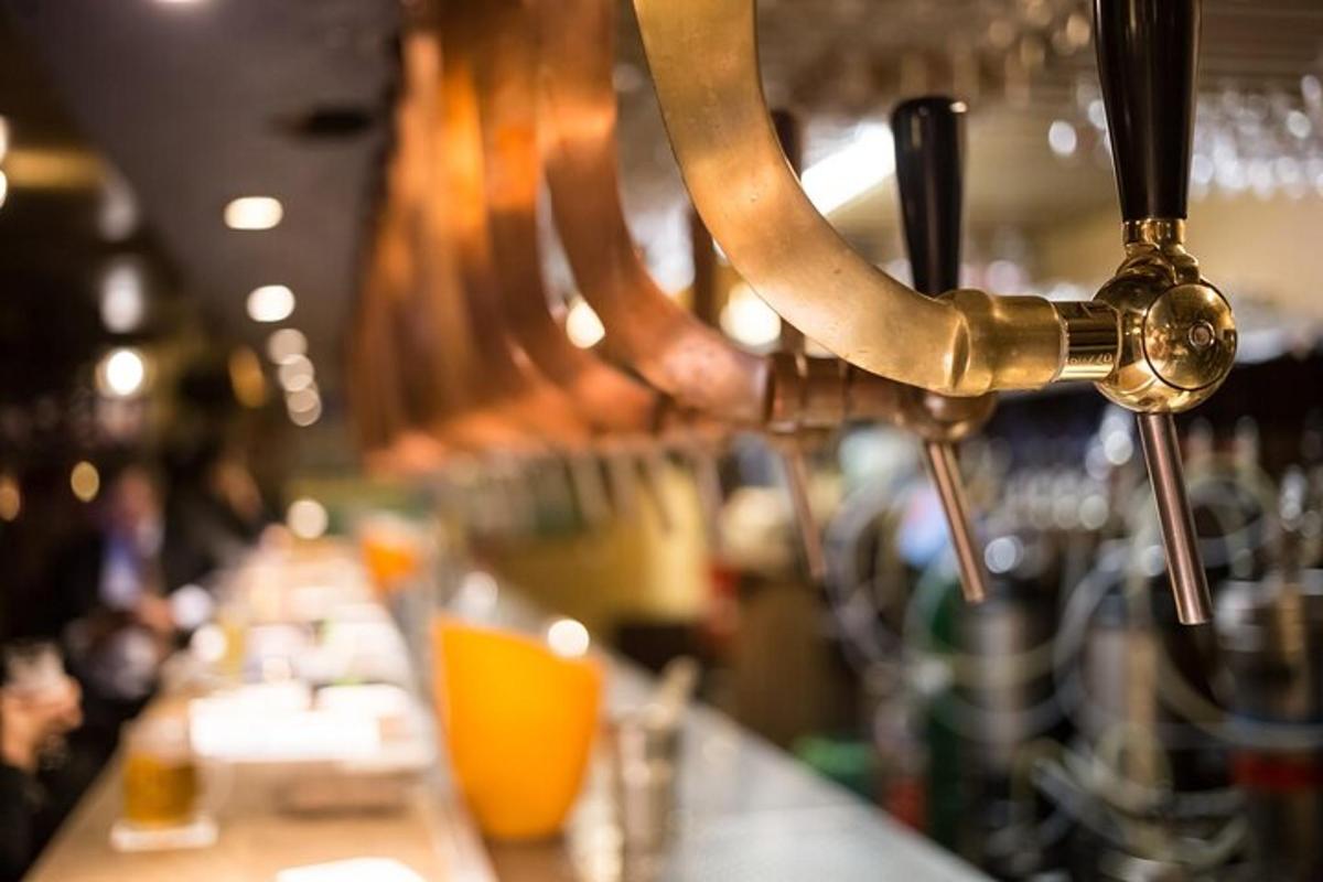 a bar with a counter with people in the background