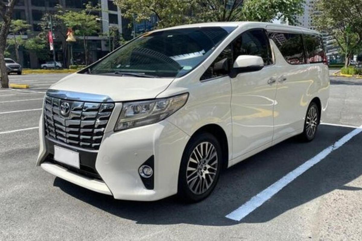 a white suv parked in a parking lot