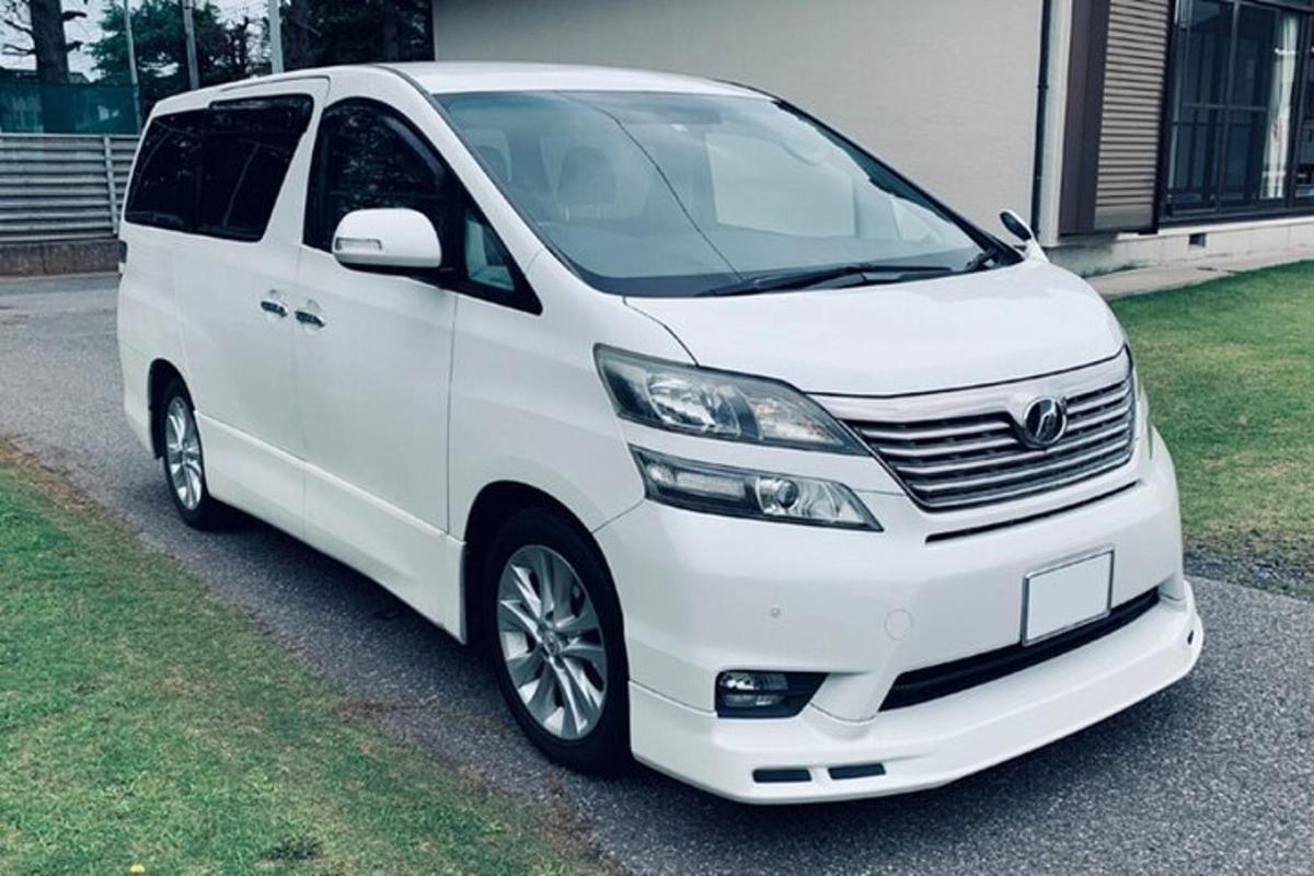 a white van parked in front of a house
