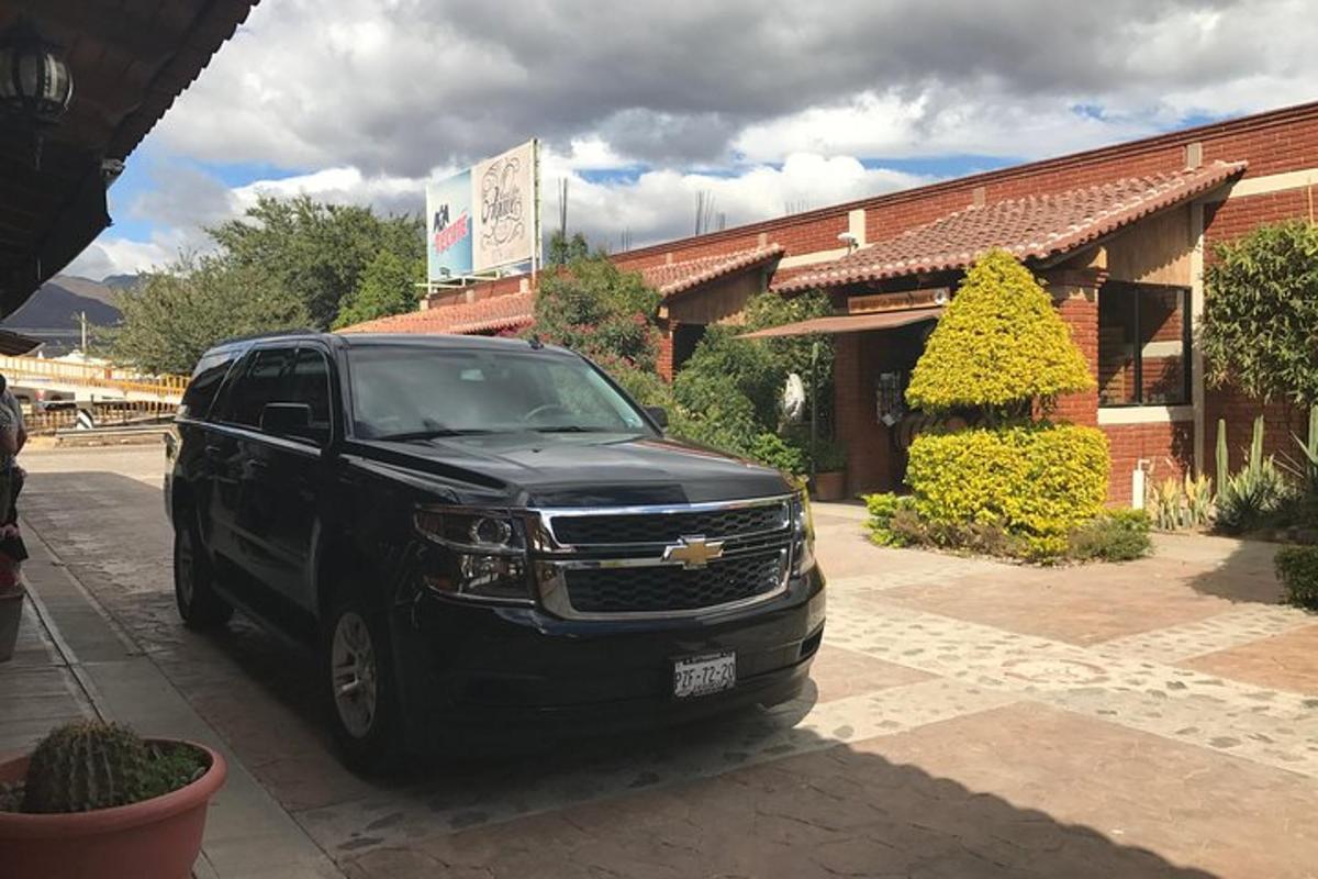 a black truck parked in front of a building