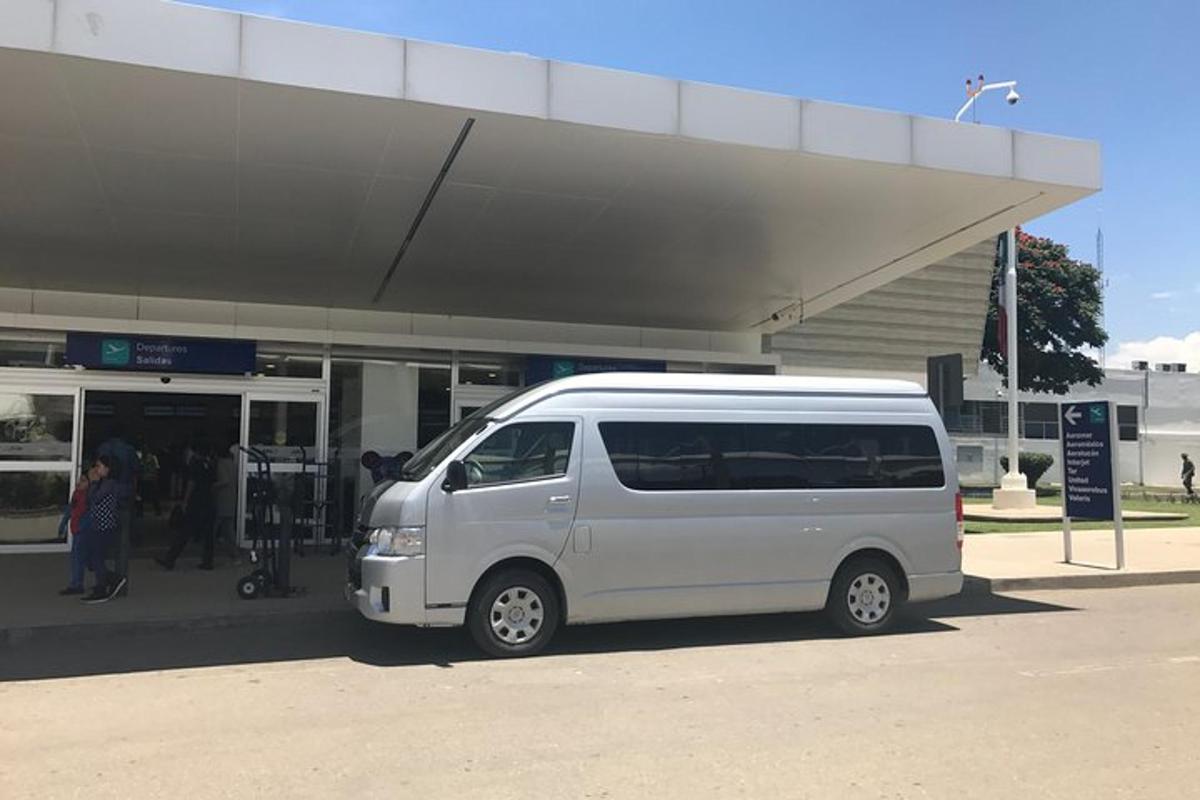 a white van parked in front of a gas station