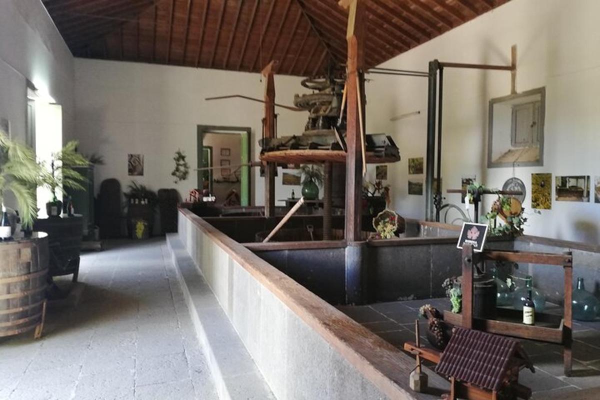 a room with a table and a bench in a building