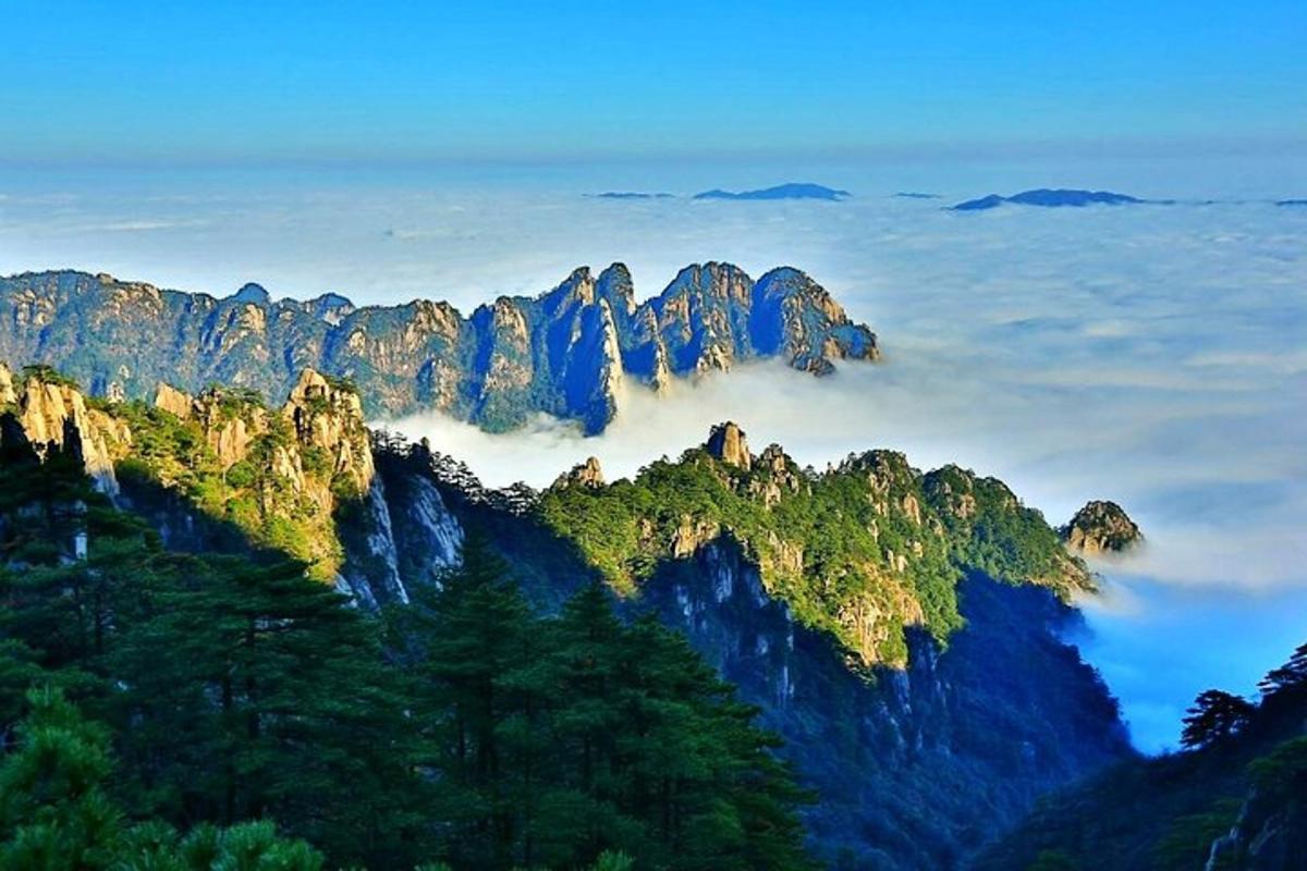 a view of a mountain range in the clouds