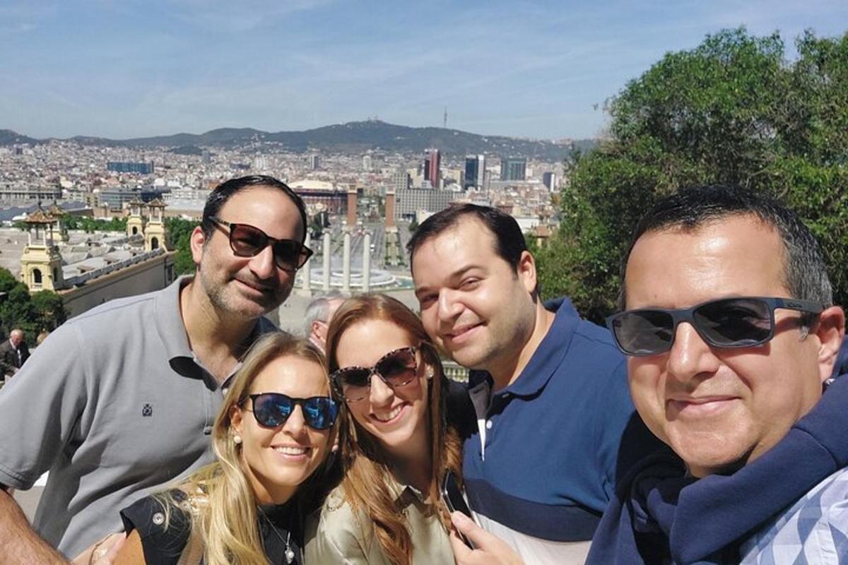 a group of people posing for a picture in front of a city