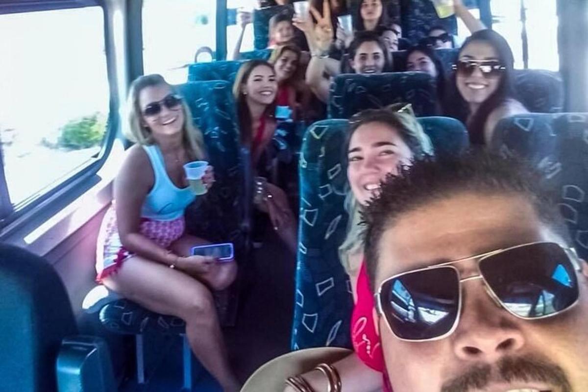a group of people sitting on a bus