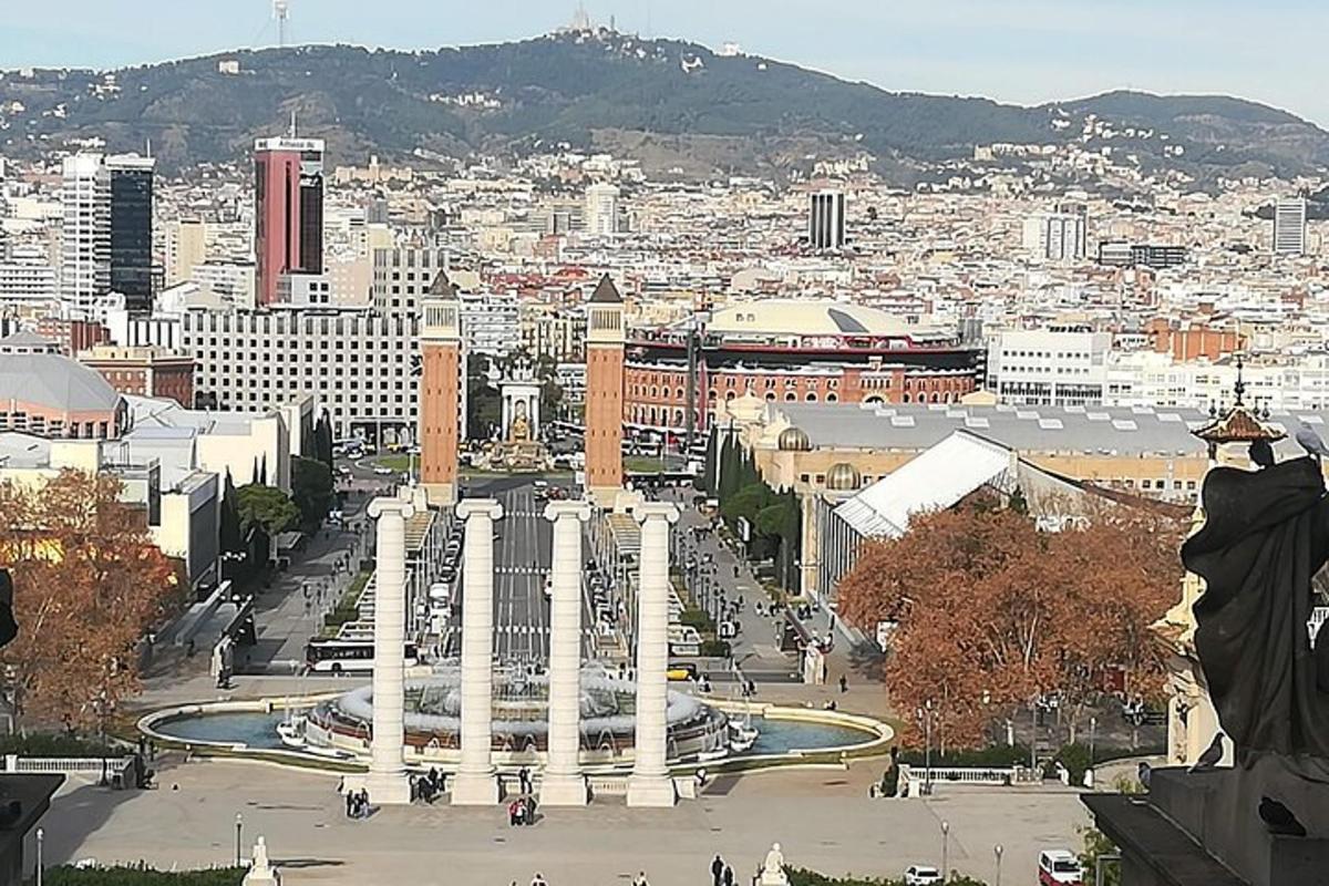 a view of a city with a fountain in the middle
