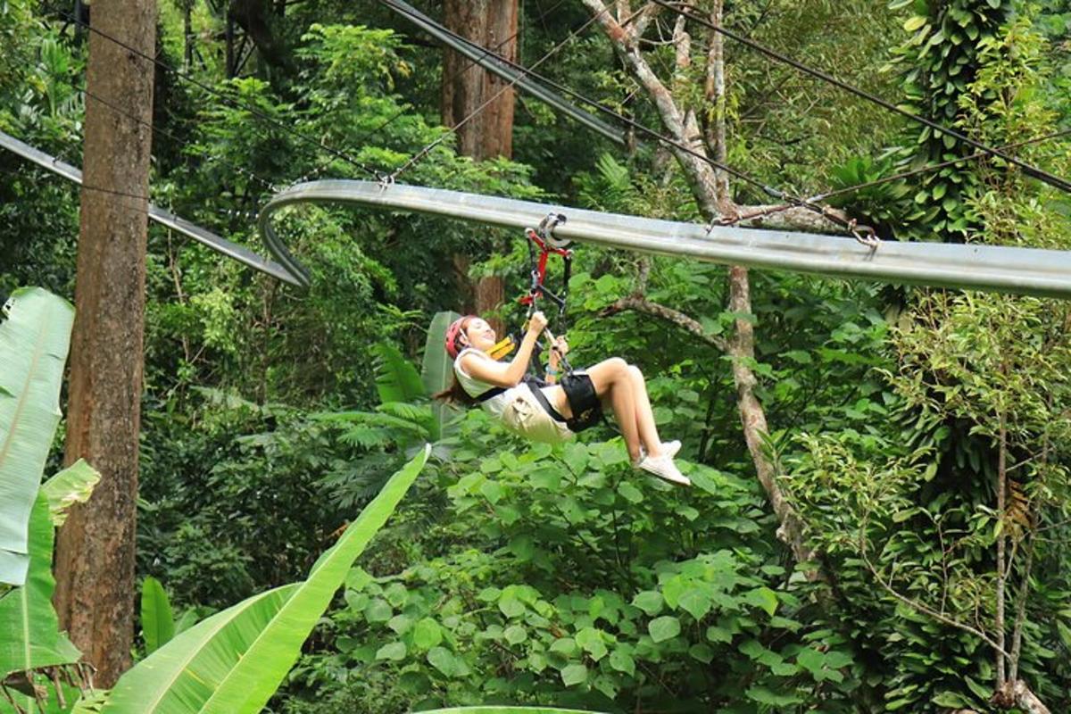 a woman on a zip line in the forest