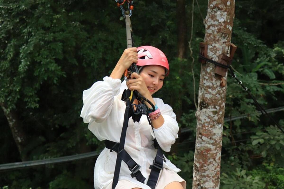 a young girl is on a zip line