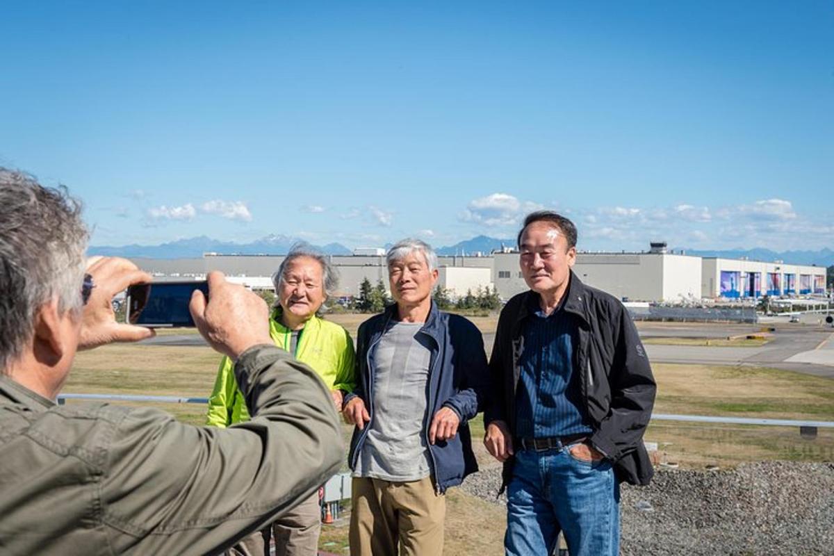 a man taking a picture of a group of men