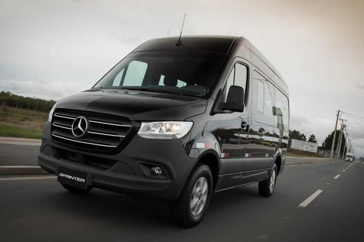 a black van is driving down a highway