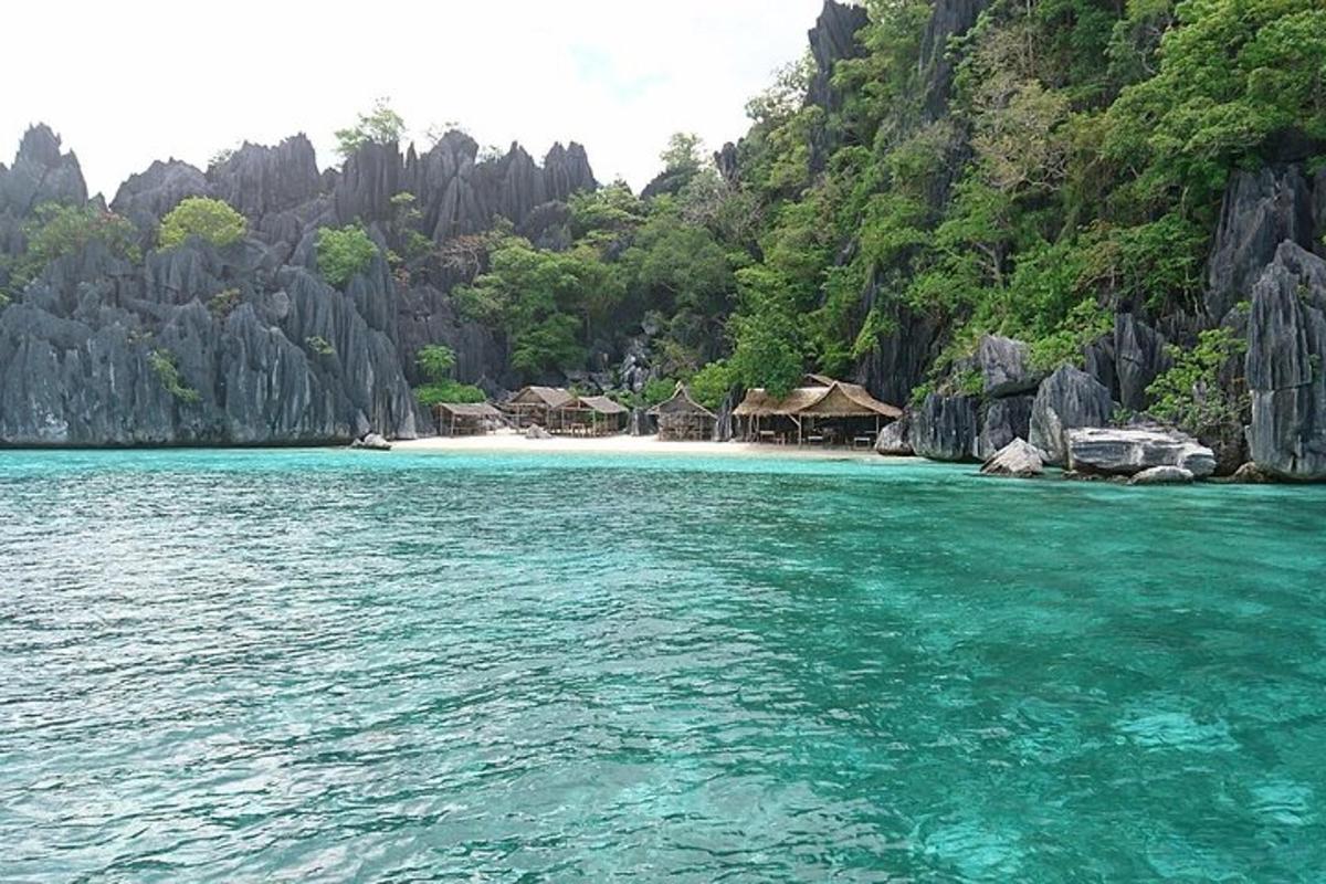 a view of a beach with houses and the water