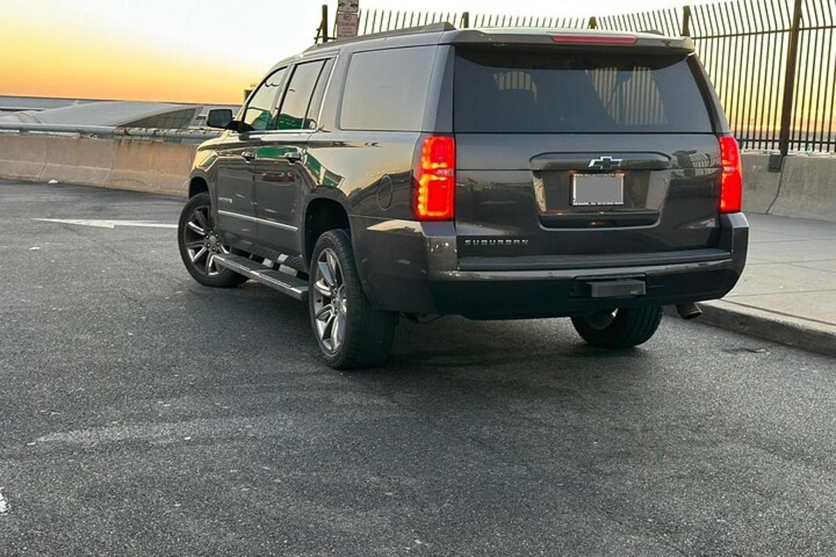 a black suv parked in a parking lot