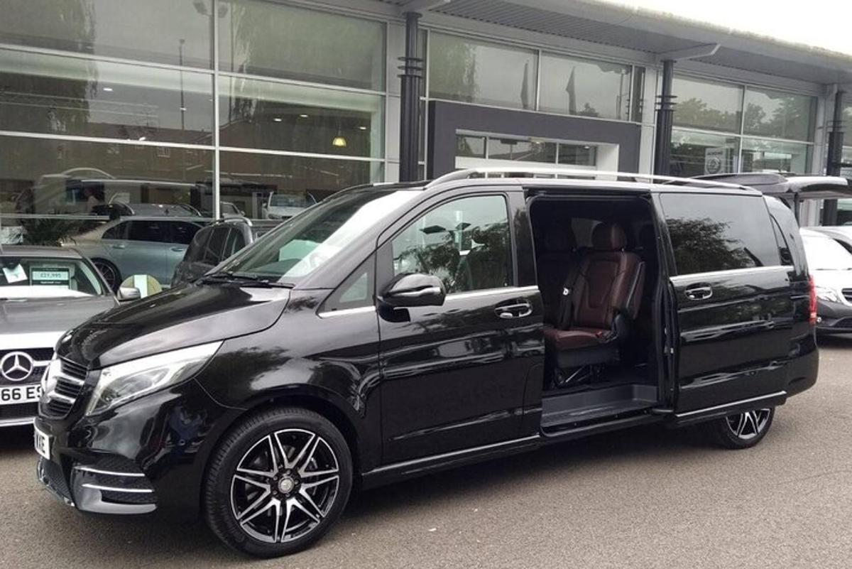 a black van parked in front of a building