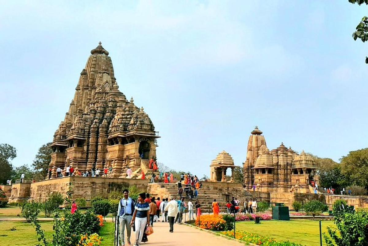 a group of people walking in front of a temple