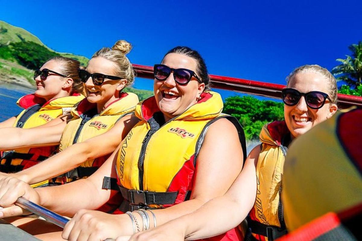 a group of people in a boat on the water