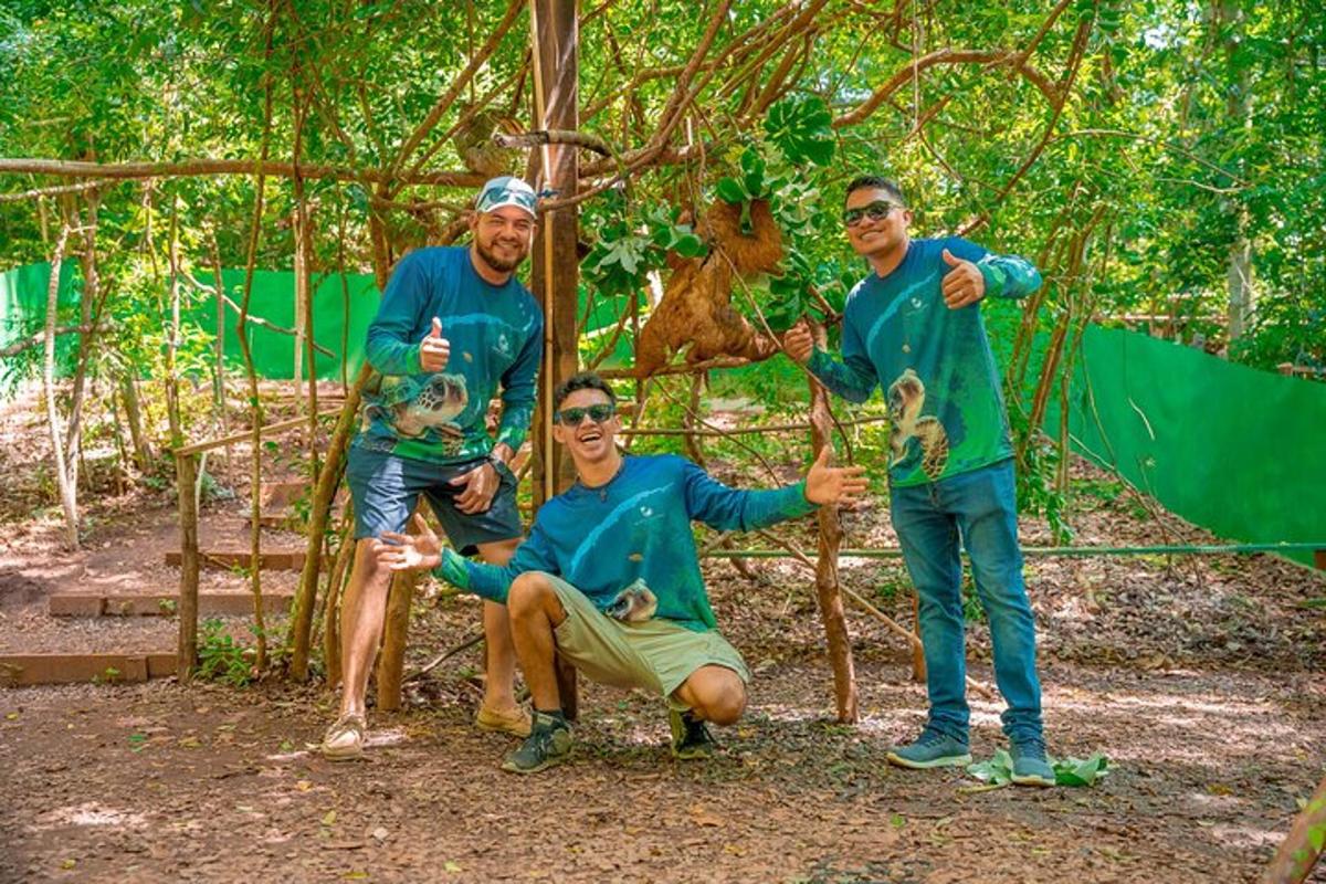 three men posing for a picture in front of a tree