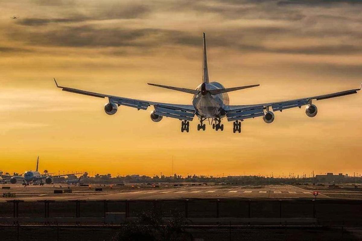 an airplane is taking off from an airport runway