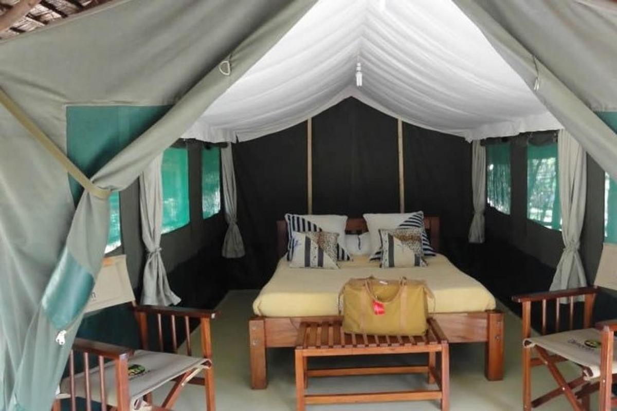 a bedroom with a bed in a tent