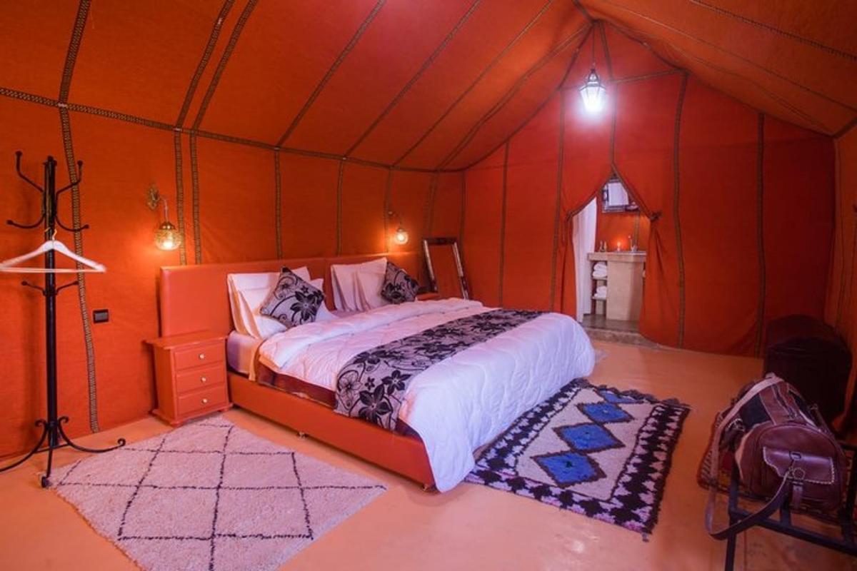 a bedroom with a bed in a tent