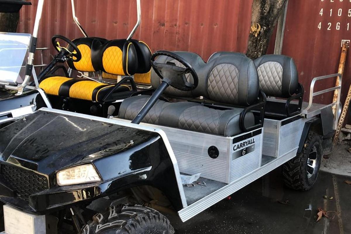 a four wheeled vehicle with a bed full of seats