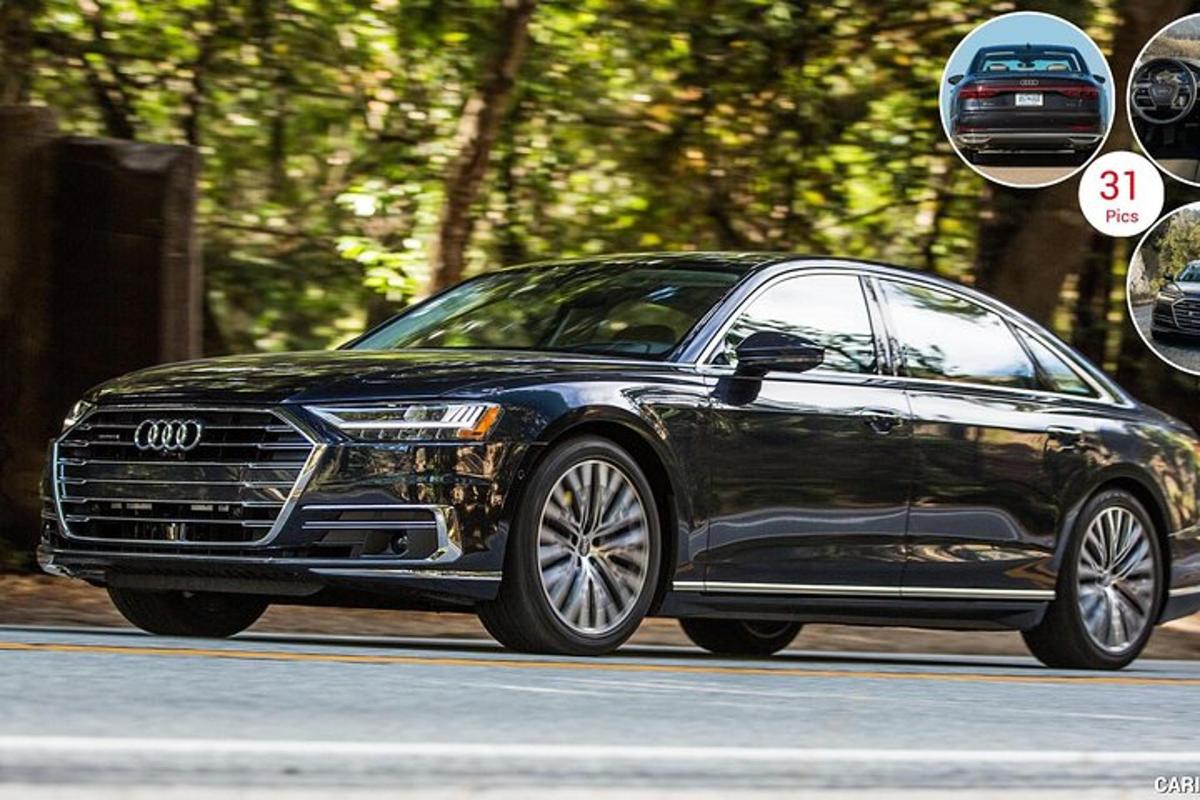 černé auto značky Audi jedoucí po silnici
