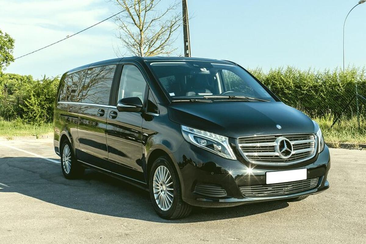 a black and silver van parked in a parking lot