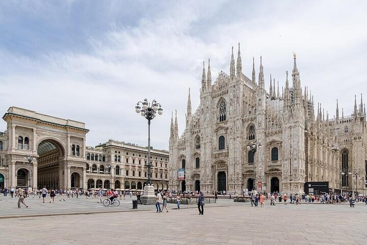 a large cathedral with people walking in front of it