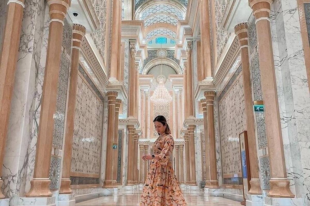 a woman in a dress standing in a building