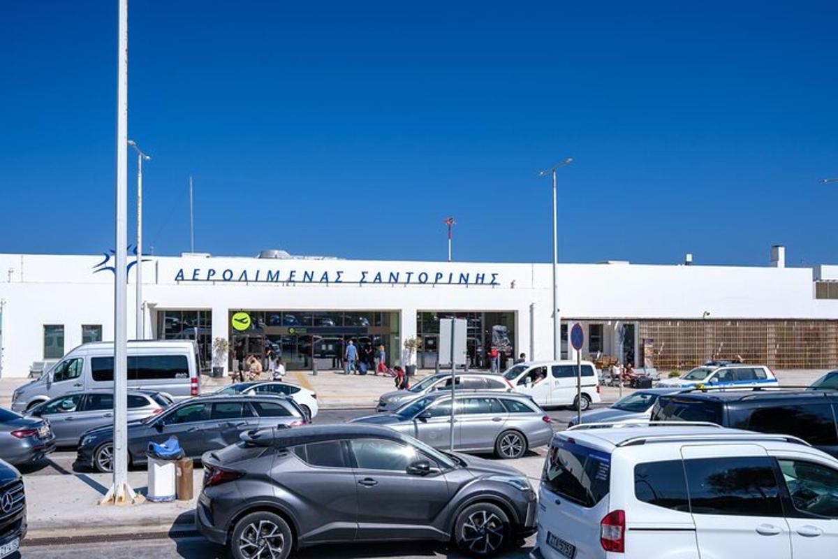 a parking lot with cars parked in front of a building