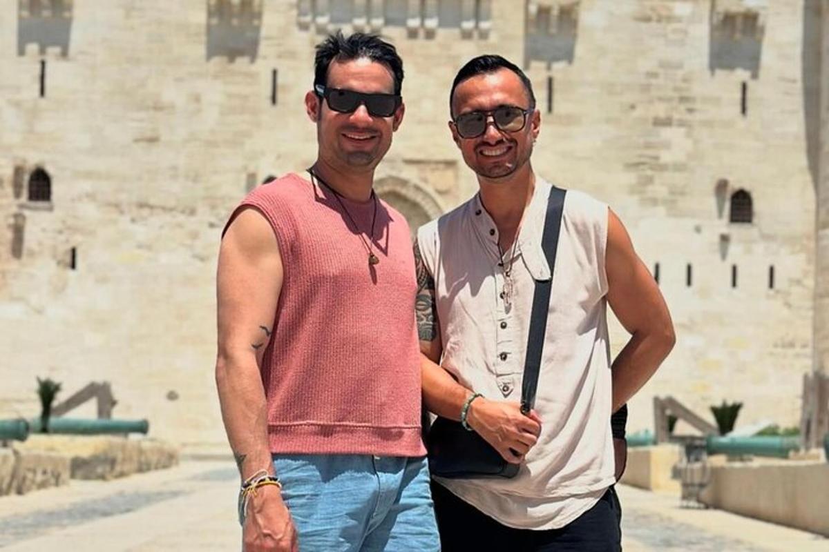 two men are standing next to each other in front of theww