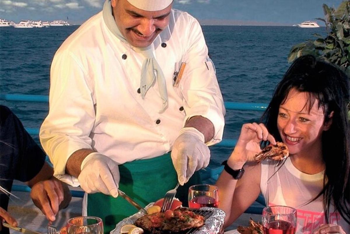 a man serving a woman a plate of food