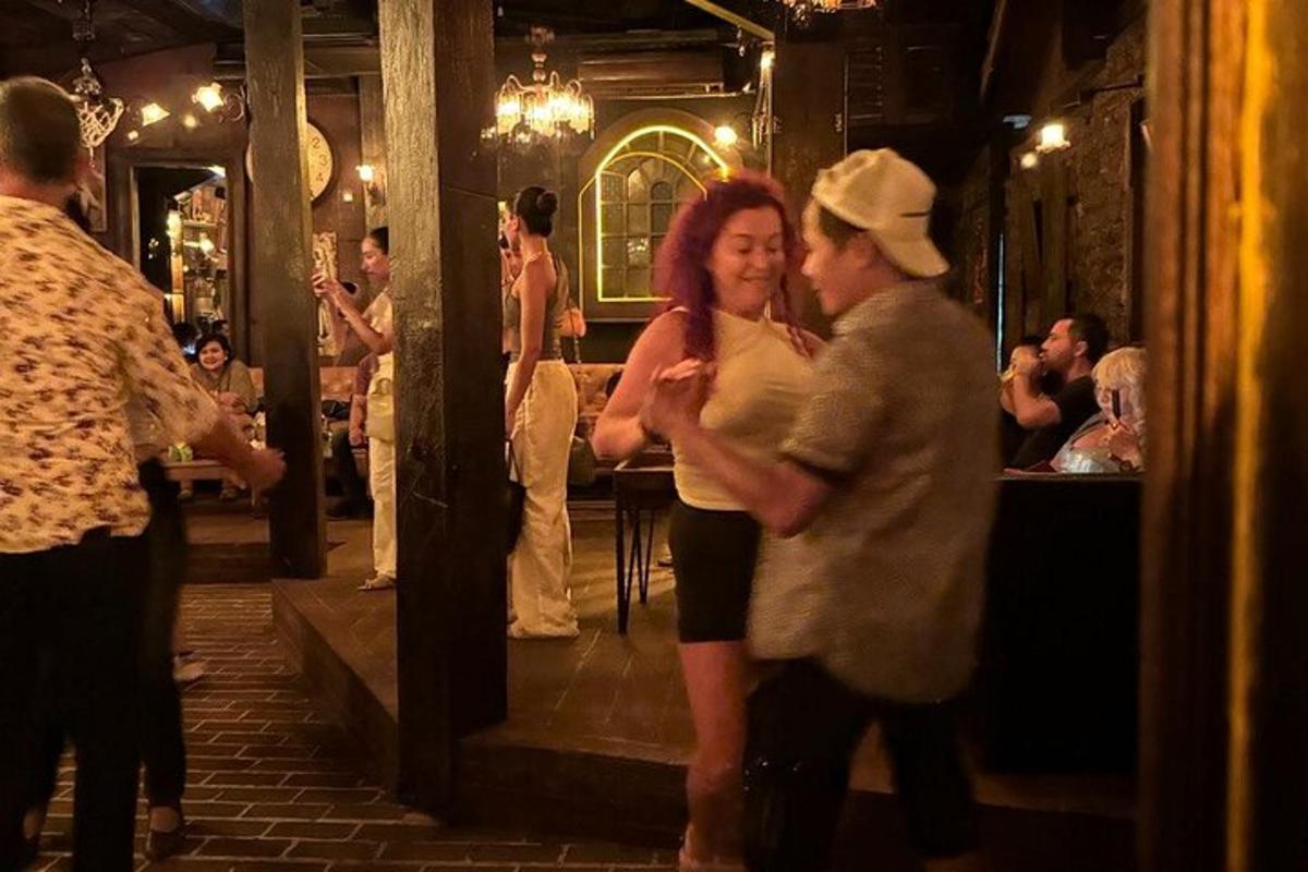 a man and a woman standing in a bar