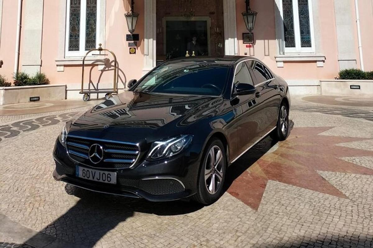 a black car parked in front of a building